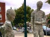 Two "Time Travelers" pass the time at Lyric Pocket Park. The pair are two of six life-size sculptures by Emil Alzamora currently on view in downtown Summit. 