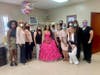Adriana Palmas, center, with members of the Cover Girls at her quinceañera. The group of volunteer women organized the party for her.