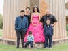 Adriana Palmas with her family on the day of her quinceañera. She and her family, who moved to South Florida from Mexico for work, have been living at the Miami Rescue Mission since last year.