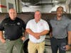 From left, Decatur County Sheriff’s Office Investigator Terry Phillips, Decatur County Fire & Rescue Captain Sam Hughes and Sarasota Police Department Detective Dominic Harris with the stolen grill and smoker.