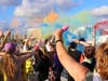 LGBTQ activists poured colored corn starch off the Ringling Causeway Bridge Saturday evening to protest the Florida Department of Transportation's denial of the city of Sarasota's request to light it for Pride month.