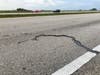 The lightning strike also left a 7-foot-long, 4-inch-wide gouge the highway's pavement.