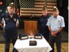 From left, FL American Legion Eastern Area Commander Daryl Bass, American Legion Post 312 Commander Gary Beardslee and District 8 Commander Skip Felicita with the remains of two unclaimed veterans, Albert Hall and Manny Fluker.