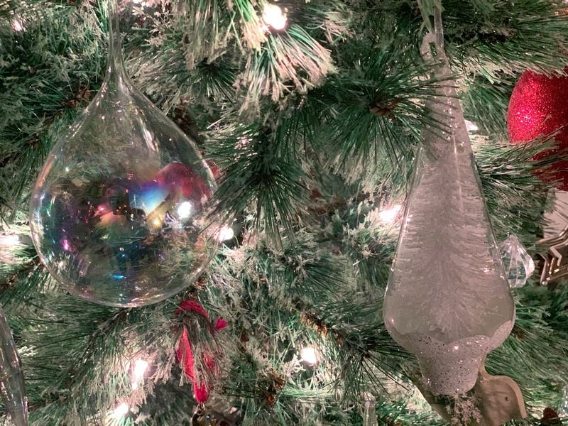 Volunteers repaired the vandalized Christmas lights Wednesday, ensuring the downtown menorah and tree lighting could go on.