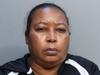 Marie Jocelyne Dorsainvil, 52, pictured, and her husband, Occius Dorsainvil, 56, face kidnapping, armed robbery, extortion and attempted murder charges after holding a man captive for three days, Miami police said.