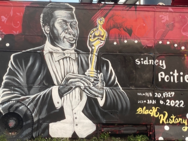 Artist Kyle Holbrook’s mural of the late actor Sidney Poitier in Little Havana honors the one-month anniversary of his death and Black History Month.