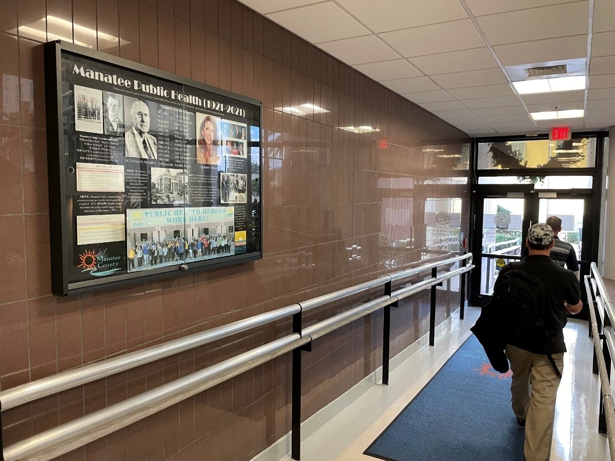 ​Manatee County leaders planned the first public health department in 1921. One hundred years later, a display about that history now hangs in the Manatee County Administration building.