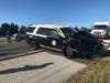 A woman drove through roadblocks for a Skyway Bridge 10K race, hitting a trooper who was trying to prevent her from driving into runners, Florida Highway Patrol said.