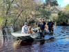 The DeSoto County Sheriff's Office received a call from a resident who was concerned after seeing a dog stranded on the roof of a recreational vehicle in the flooded River Acres community.