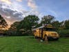 A couple in the UK converted a retired Manatee County school bus into a camper offering a glamping experience in West Sussex, England.