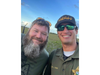 Tre Huntoon, left, a star of Animal Planet's "Gator Boys," lent a hand in wrangling the reptile, the Monroe County Sheriff's Office said. He's pictured with Deputy Jason Farr.