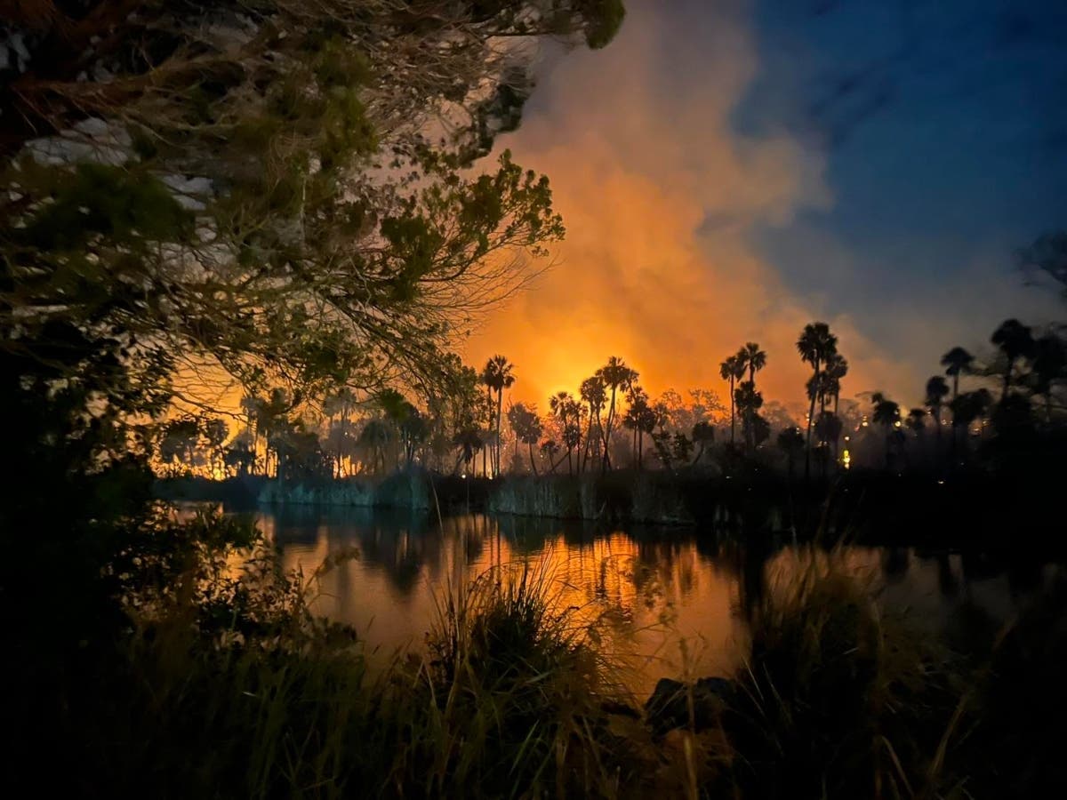 Firefighters continue to battle a 120-acre brush fire at the Weeki Wachee Preserve in Hernando Beach, officials said. 