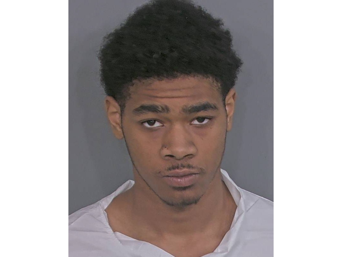 An 18-year-old neighbor was charged with murder and three counts of attempted murder for a fatal house fire, St. Pete police said. His father was also arrested for tampering with physical evidence.