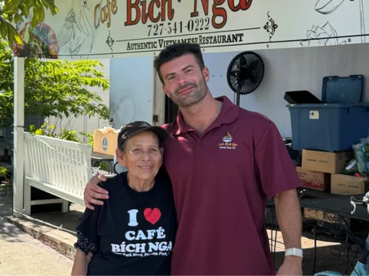 Tampa influencer and business owner Julian Becerra, right, raised $200K to rent a home for the 85-year-old woman, Lieng Le, who runs Café Bích Nga and is currently homeless. Le frequently sleeps in the restaurant's lobby.