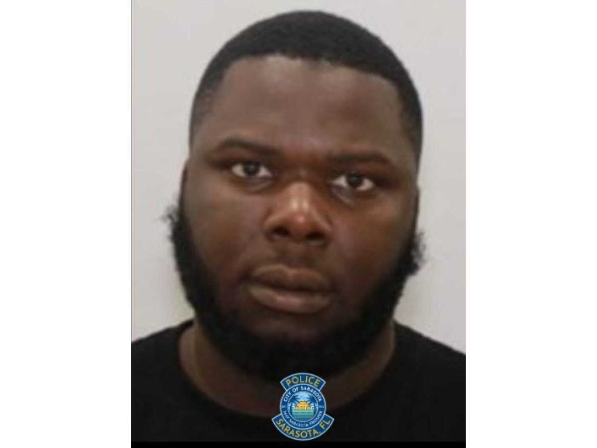 A Palmetto man is wanted on firearm charges connected to a shooting incident at Booker High School, Sarasota police said.