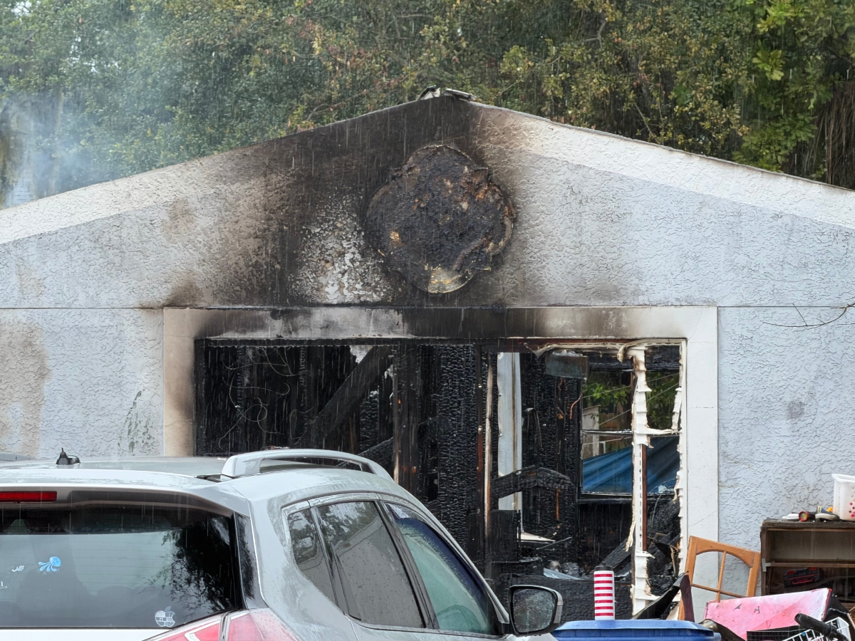A Sarasota County firefighter was hospitalized after a medical emergency while responding to a house fire now under state investigation.