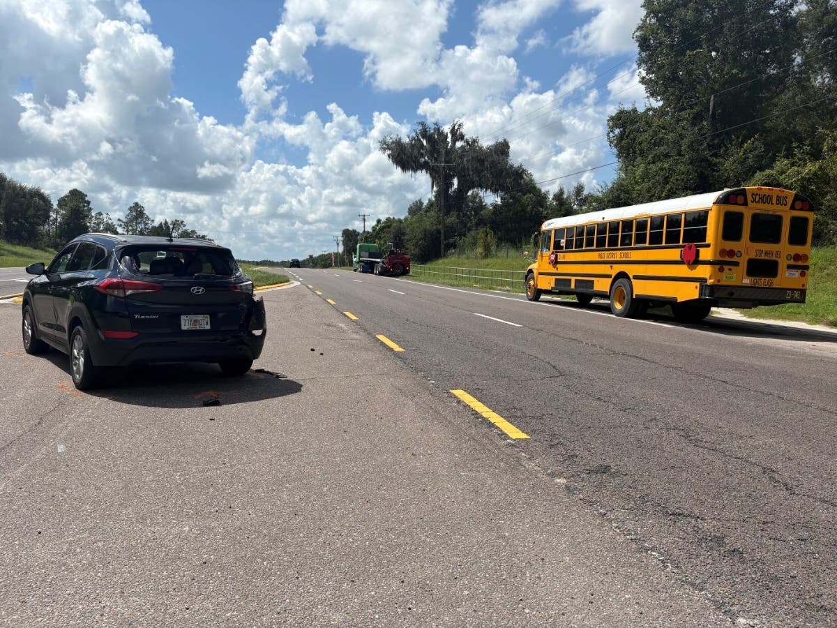 A semi-truck hit an SUV and a stopped school bus in Pasco County, leaving four people with injuries, including one child, FL troopers said.