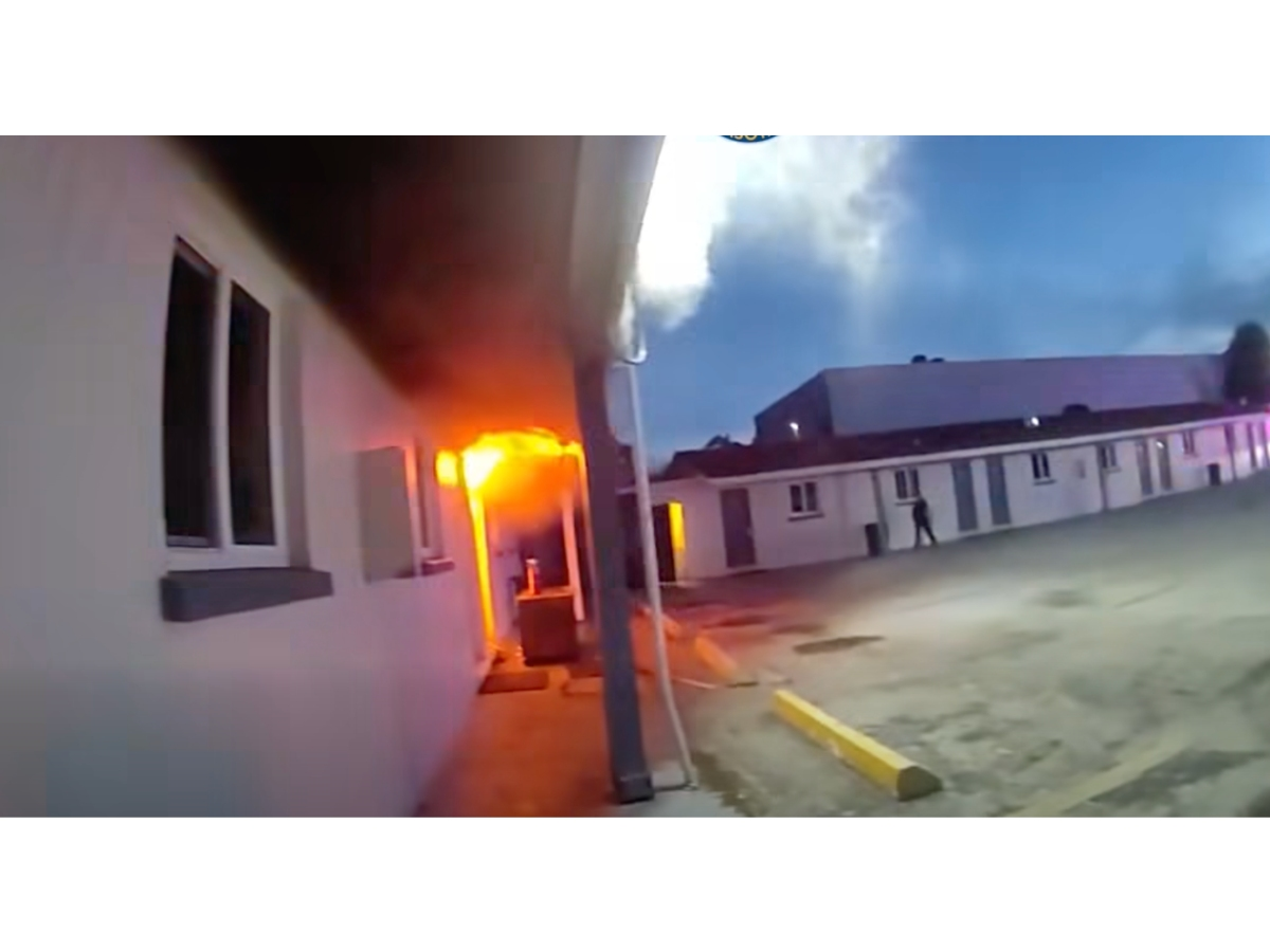 Watch officers go room to room to evacuate residents during a fire at a Sarasota motel.