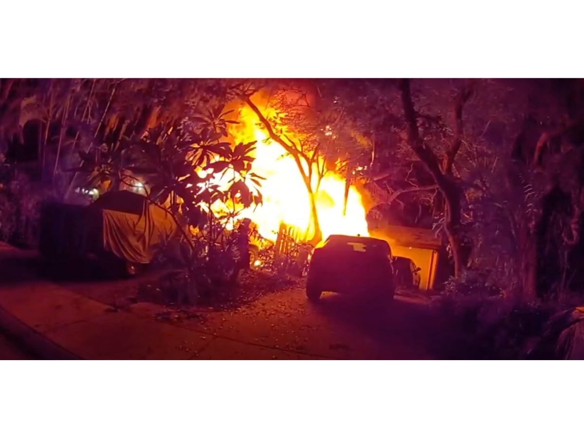 Officers evacuated neighbors after a fire ravaged a wooden carport at a Clearwater home, police said.