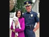 Chief John Carmichael with Mayor Ruthanne Fuller holding Newton Police Department's new puppy.