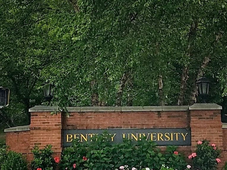 Bentley University in Waltham has fired an adjunct professor after she was charged in the death of Boston Police officer John O’Keefe.