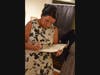 Local, award winning author Susan Strecker signs one of her latest books.