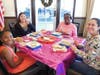 Girls making gingerbread houses