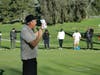 John Ward, the tournament organizer instructing the golfers on the putting green. 
