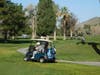 Golfers heading out on the course going toward their designated holes