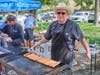 Morgan McComas from the Hemet Kiwanis getting lunch ready for the young anglers. 