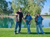 Proud father displays his daughters catch for the day. 