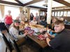 Boy Scout Troop 46 stuff all the plastic eggs before the kids arrive.