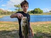Dylan Black catches his 4 pounder bass along with the other 40 fish he caught.