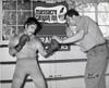 Earl Gilman III in the boxing ring with Armando Munoz Lightweight boxing Champion at the ring at Gilman Hot Springs circa 1970