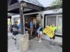 The children going to the summer camp welcoming golfers to their fundraising tournament. 