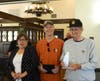 Father Henley presented with award for his service by Mr. & Mrs. Powelson