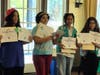 Four of the girls getting their certificates.