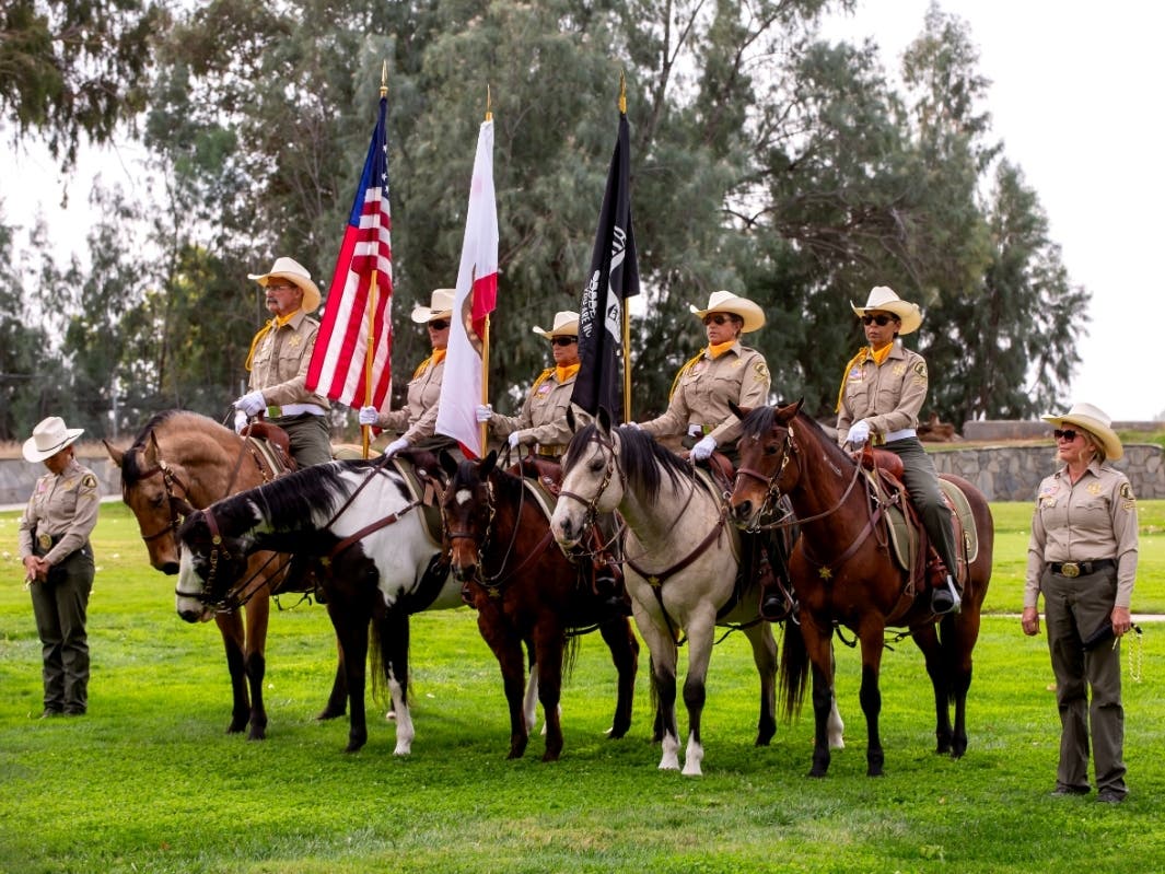 https://patch.com/img/cdn20/users/24619491/20261008/022304/styles/patch_image/public/the-posse-stands-tall-during-the-national-anthem___08141807875.jpg