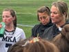 MKA junior defender Grace Fitzgerald (7) takes drink of water during timeout in team huddle along with coaches Marnie McNany and Kristen Dawes   