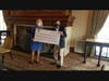 President and Chief Executive Officer Ruth Colby accepts $116.5k check from Golf (un) Outing Committee Chair Rudy Mahalik, Jr. 