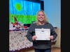 Michelle Walsh, a respiratory therapist at Silver Cross Hospital in New Lenox, proudly displays the Rock Star Award she received for bringing happiness and joy to Neonatal Intensive Care Unit babies and their families.