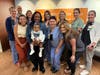Members of the NICU team enjoy a visit with Nyla and mom NaKeya Moffett.