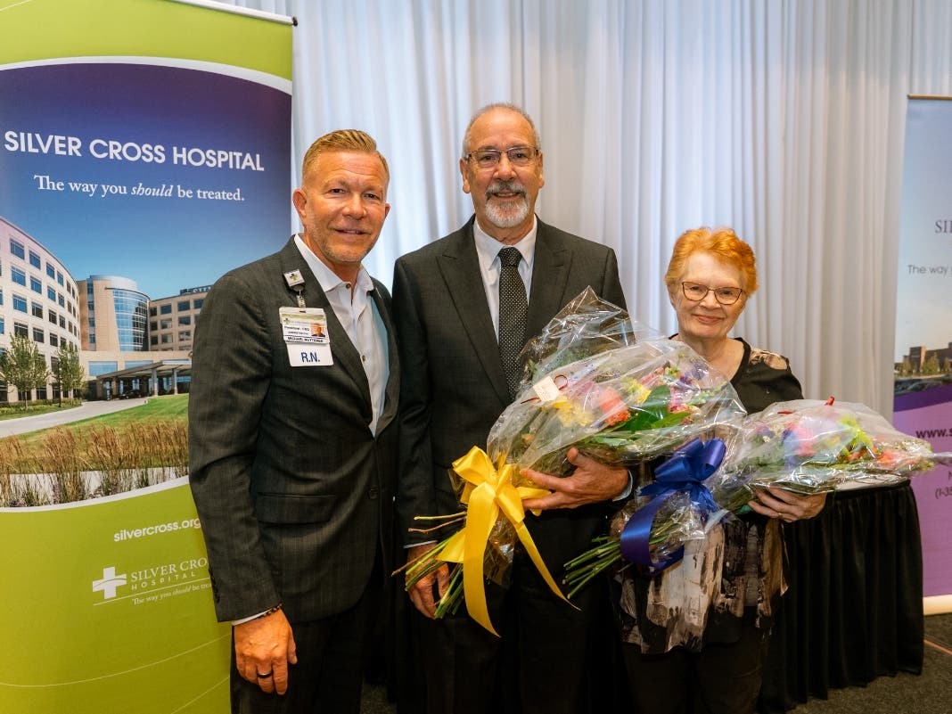 Silver Cross President and CEO Michael Mutterer congratulates 55-year employees Kenneth Schroeder of Manhattan and Doretta Dragovan of Joliet during the annual Silver Cross Employee Service Awards Dinner held Sept. 9 at DiNolfo's Banquets in Homer Glen.