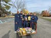 Basket ball team and coach supporting the food drive at Middlesex college 
