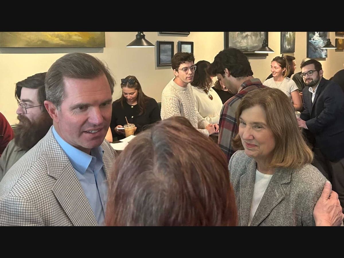 Gov. Andy Beshear (D-Ky.) and Democratic candidate for governor Cinde Warmington greet voters at the Brothers Cortado coffee shop in Concord.