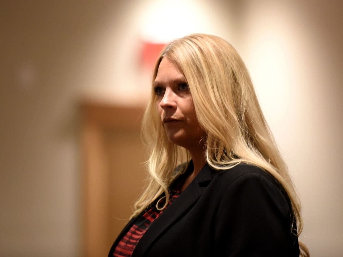 Kristy Gesse finds her seat during closing statements in her civil trial against DHHS at Merrimack County Superior Court in Concord on June 29.
