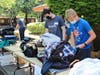 Teenagers sort and fold donated clothes to be delivered to White Pony Express 