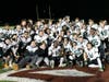 Burnett stands in the last row with his teammates after winning the Ken O’Keefe Bowl against New Hampton School.
