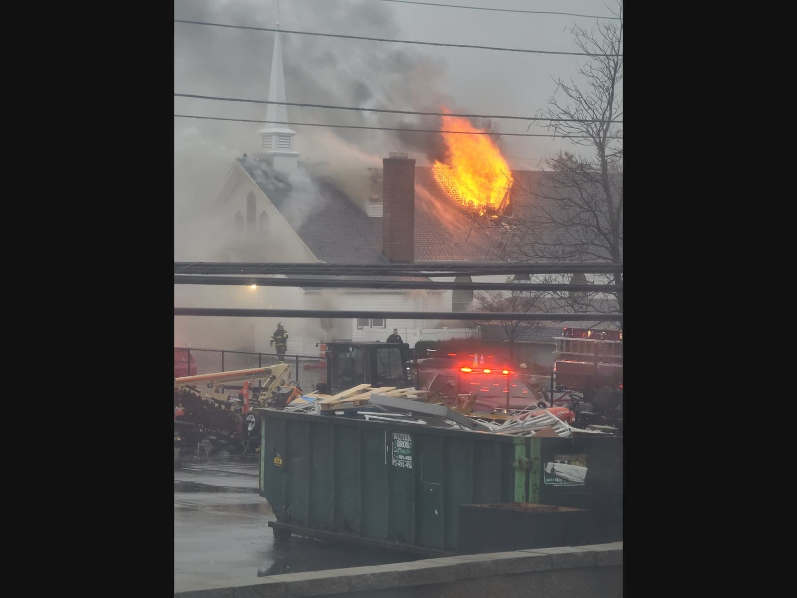 Flames shooting from the roof of Good Shepherd Lutheran Church in Levittown this morning.