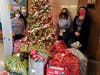 Eight families with children attending Lee Avenue Elementary School received gifts from the toy drive ran by Chris Mirro and Nick Mirro and the Hicksville Gardens Civic Association.